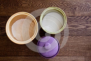 Set of three canisters with top down perspective containing baking ingredients