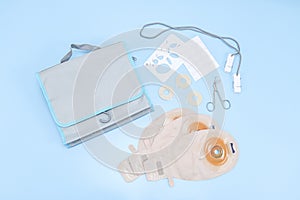 A patient set of colostomy bag on a gentle blue background.