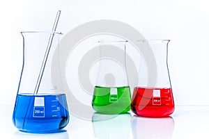 Set of three conical temperature resistant flasks with color liquid