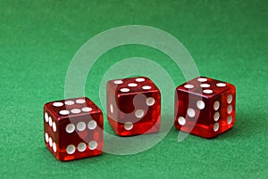 Set of three dice on green