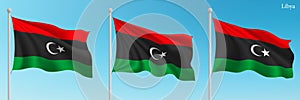Set of three flags of Libya waving on flagpoles