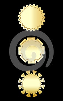 A set of three gold framed badges and labels isolated on black.