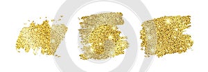 Set of three golden glittering smears on a white background