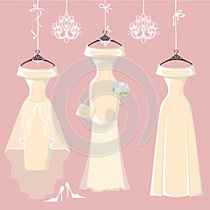 Set of three long bridal dresses hang on ribbons