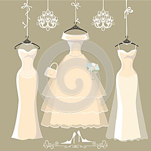 Set of three long bridal dresses hang on ribbons