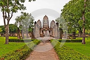 Set of three pagodas in sukhothai and walkway