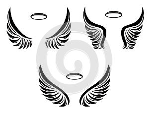 Set of three pairs of vector angel wings with nimbus