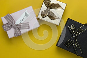 Set of three realistic New Year and Christmas gift boxes concepts yellow background banners design