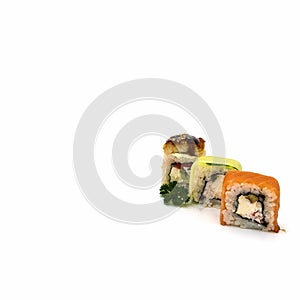 A set of three rolls: with eel  cucumber  salmon  close-up.