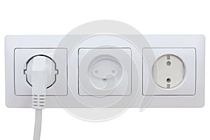 Set of three sockets on white isolated background. Childproof, safety plug inserted into the socket. The idea is the safety of