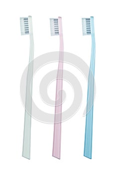 Set of three toothbrushes of different colors isolated on white background.