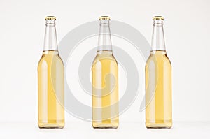 Set of three transparent longneck beer bottle 500ml with lager, mock up.