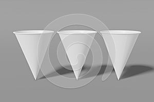 Set of three white paper mockup cups cone shaped on a grey background. 3D rendering