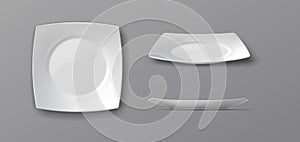 Set of Three White Plates on Gray Background