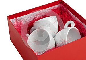 Set three white porcelain cups gift box open unwrapped isolated