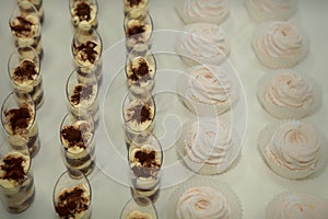 set of tiramisu and zephyr desserts rowed on table