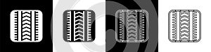 Set Tire track icon isolated on black and white background. Vector