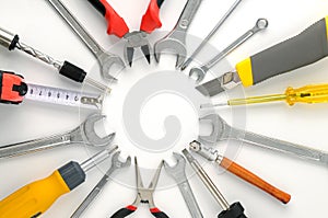 Set tools arranged around circle on white