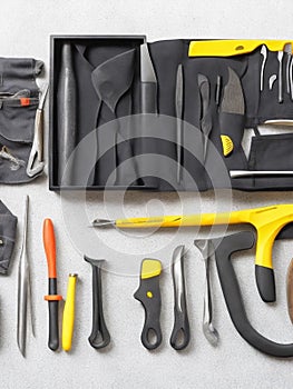 Set of tools in a box on a light background, top view with Generative AI