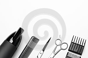 A set of tools for hairdresser, hairdryer, scissors, comb, on white background, top view, a copy of the space