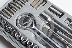 Set of tools of heads in a box.