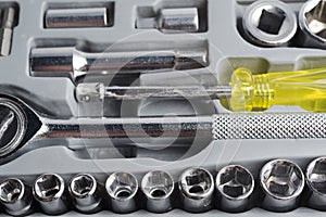 Set of tools of heads in a box.