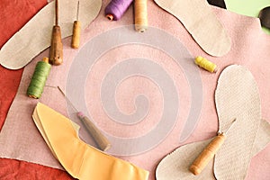 Set of tools with threads on leather in workshop