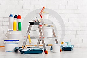 Set of tools for wall paint in new home, flat, white bricks wall