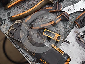 A set of tools and wrenches in a car workshop