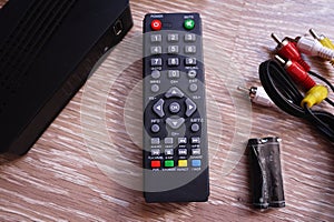 Set-top box for receiving video and TV signal. Remote control. Details and close-up.