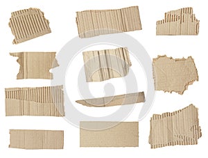 Set of torn cardboard pieces on background