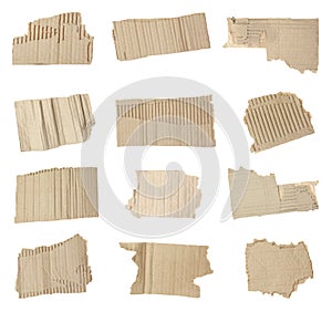 Set of torn cardboard pieces on background