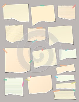 Set of torn yellow note, notebook paper pieces stuck with sticky tape on gray vertical background. Vector illustration