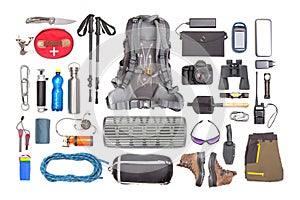 Set of tourist trekking items on white background. Top view of accessories for travel. Equipment for travel and hiking. Survival