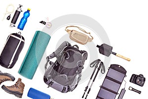 Set of tourist trekking items on white background. Top view of accessories for travel. Equipment for travel and hiking. Survival