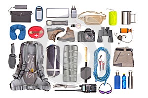 Set of tourist trekking items on white background. Top view of accessories for travel. Equipment for travel and hiking. Survival