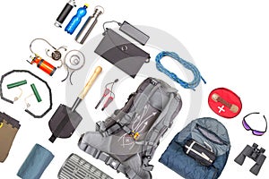 Set of tourist trekking items on white background. Top view of accessories for travel. Equipment for travel and hiking. Survival