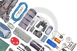 Set of tourist trekking items on white background. Top view of accessories for travel. Equipment for travel and hiking. Survival