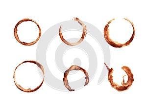 Set of traces of cup of coffee isolated on white background. Round coffee blots. Round frame made of spilled coffee. Elements for