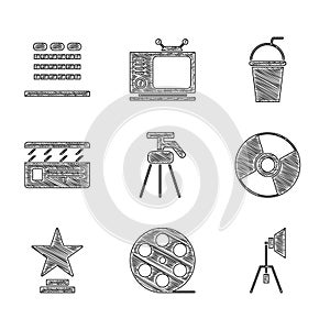 Set Tripod, Film reel, Movie spotlight, CD or DVD disk, trophy, clapper, Paper glass with straw and Cinema auditorium