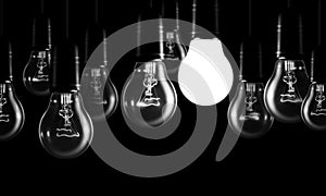 Set of tungsten light bulbs on black background.
