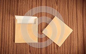 Set of two Brown envelope front and back isolated on wooden table hardwood floor background. Business cards blank. Mockup. Top