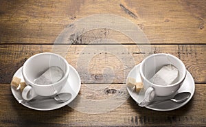 Set of two ceramic tea mugs with tea bags