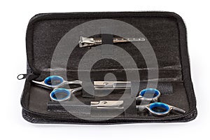 Set of two different professional hair scissors in leathern case