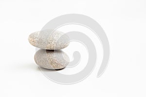 Set of two pebbles on the white background