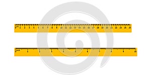 A set of two yellow rulers measuring in centimeters and inches