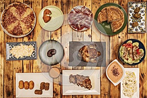 Set of typical Spanish tapas, alioli potatoes, acorn-fed ham tray, assorted croquettes, Galician empanada, salmorejo with croutons photo