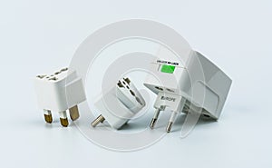 Set of universal plug adapters for travel around the world isolated