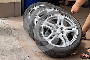 Set of used stylish car wheels with low profile summer tires. Sale of car spare parts