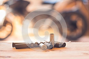 A set used to of old bullets and cartridges on wood background